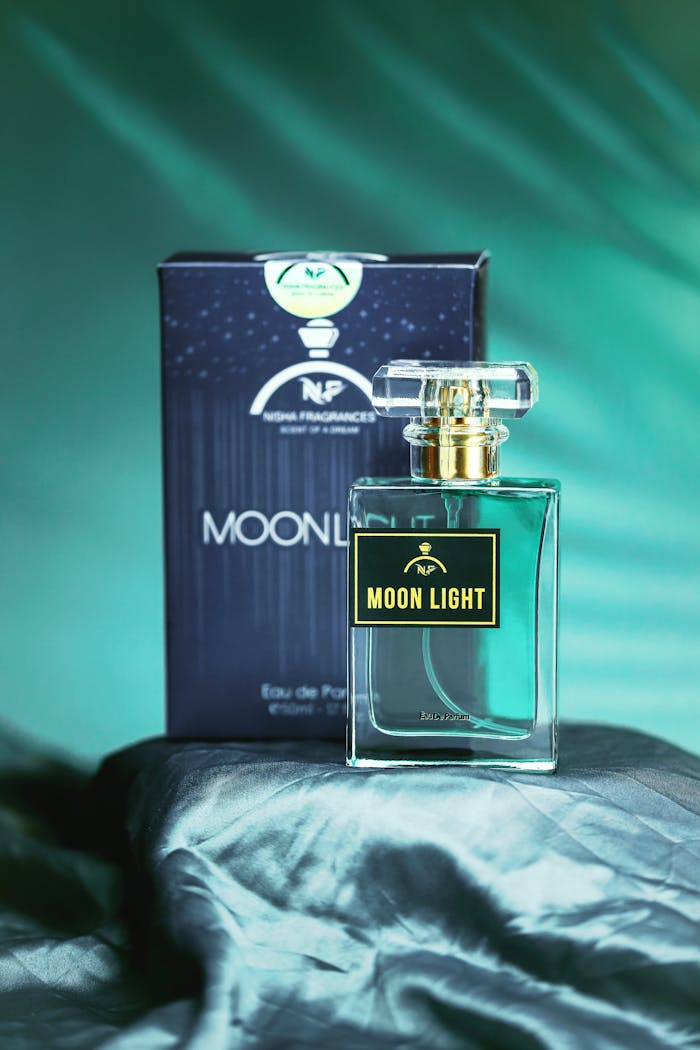 A luxurious Moonlight perfume bottle with a cinematic backdrop, embodying elegance and style.